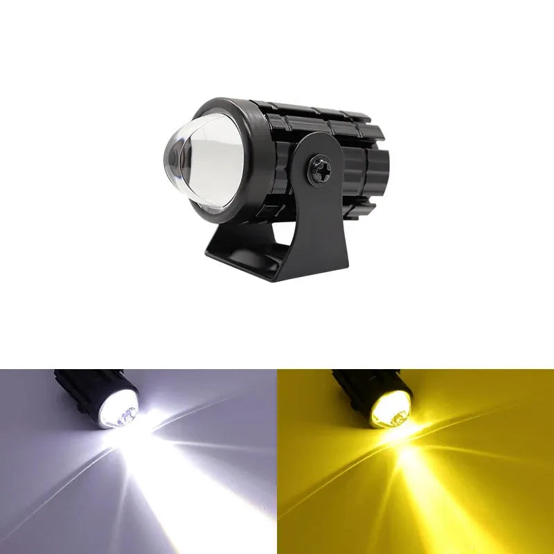 Motorcycle spotlight with dual-colour lens, aluminium housing, showing white and yellow light modes.