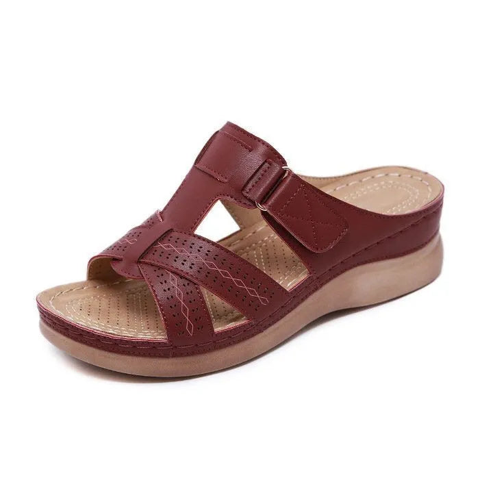 Women's red peep toe wedge sandals with a Velcro strap and hollow wedge heel.
