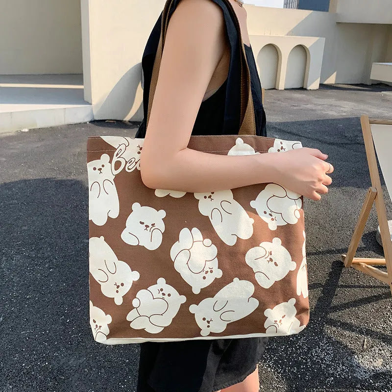 Cute bear printed canvas shoulder bag in beige and black colourways for women and students