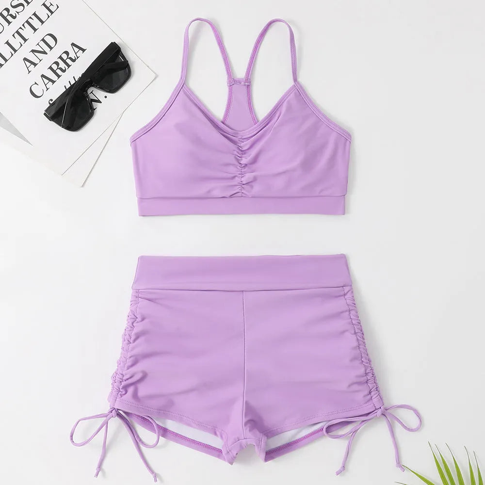 Purple women's high-waist split bikini swimsuit top and shorts set.