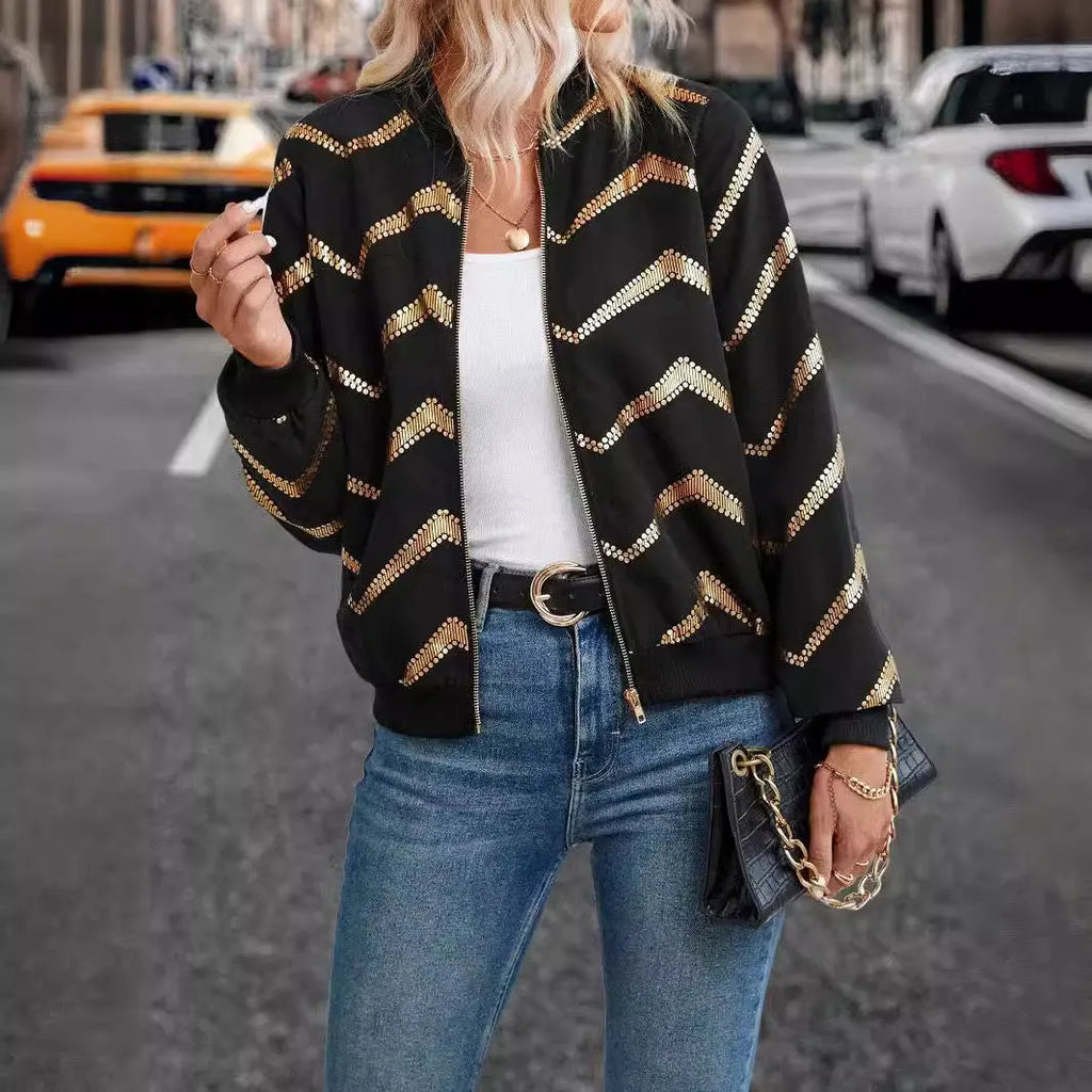 Women's black polyester spring jacket with gold zigzag print, conventional sleeves, shown on model