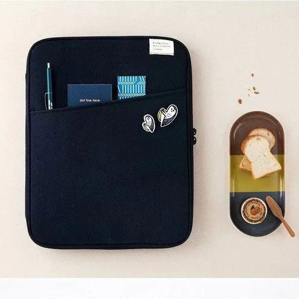 Brick red nylon shockproof tablet PC bag liner with zip closure and card slot on table