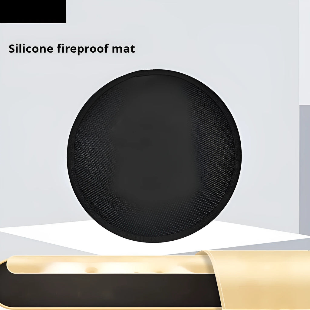 Black round barbecue fireproof mat with oil-resistant surface on a garden patio