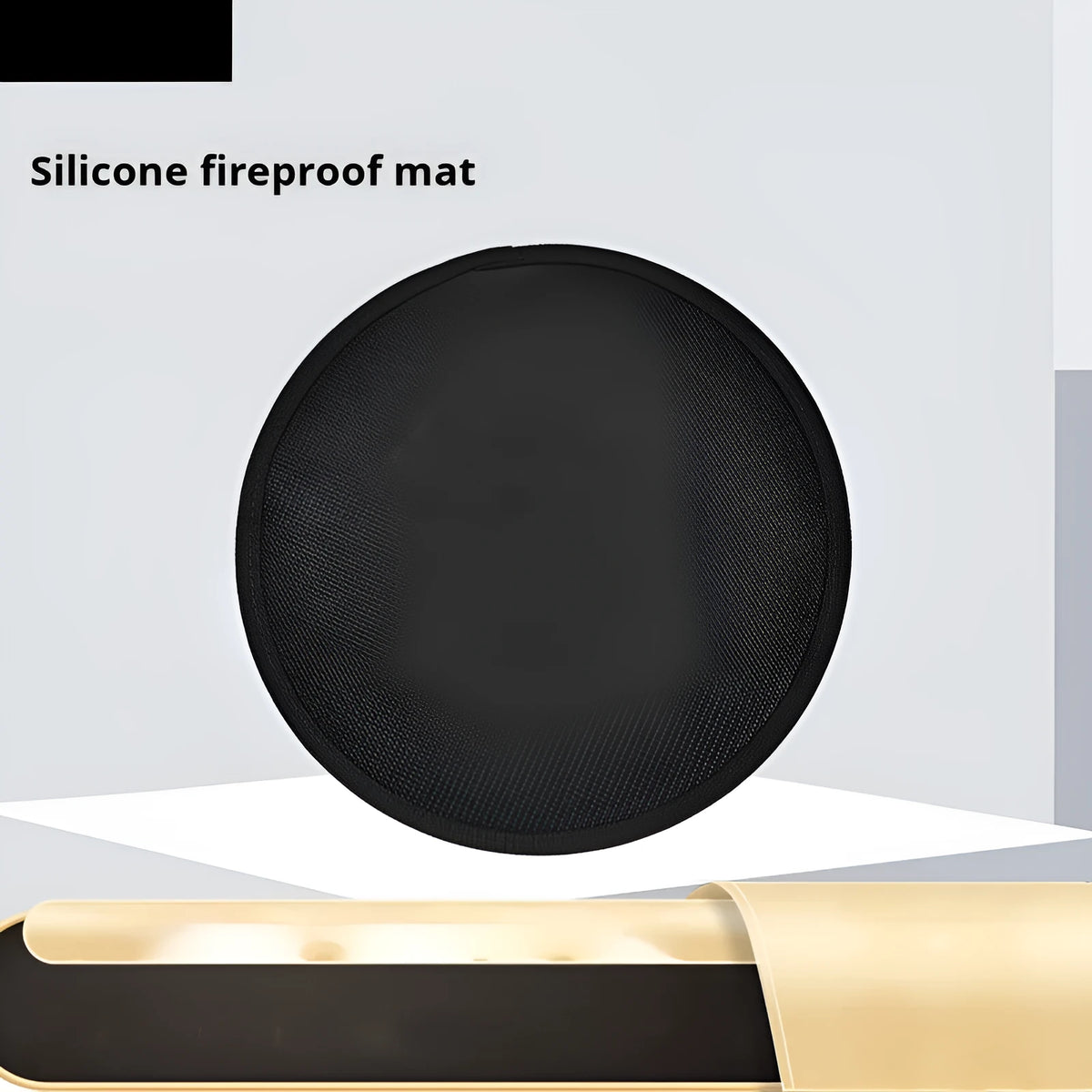 Black round barbecue fireproof mat with oil-resistant surface on a garden patio