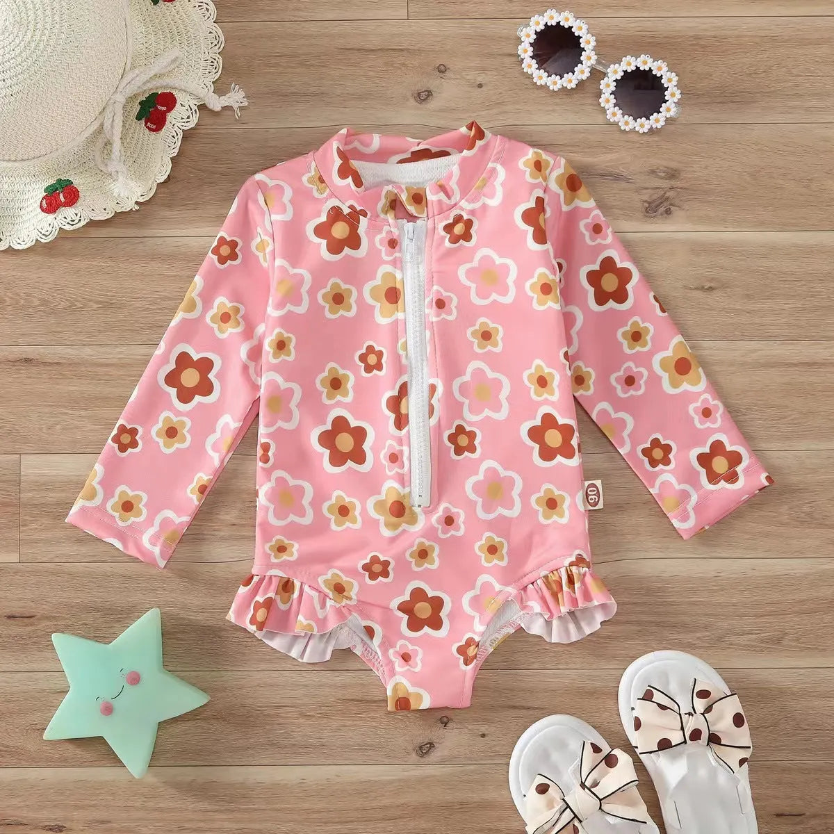 Girls' floral zipper romper swimsuit in pink with front zipper and brief-style bottom