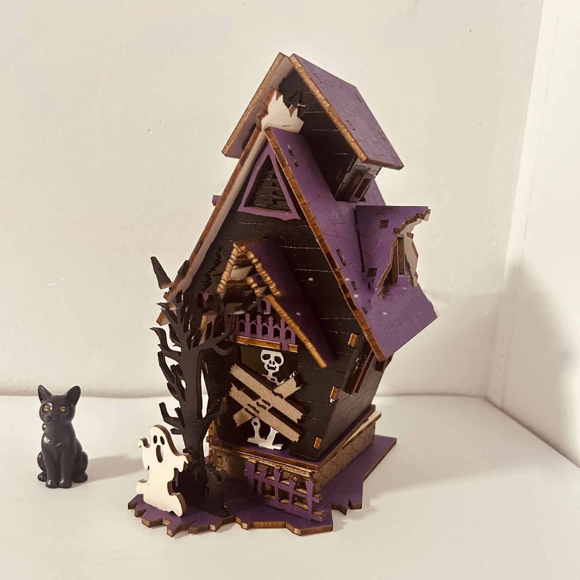 Wooden Halloween haunted house table decoration with candlestick design measuring 14x10.5x19cm