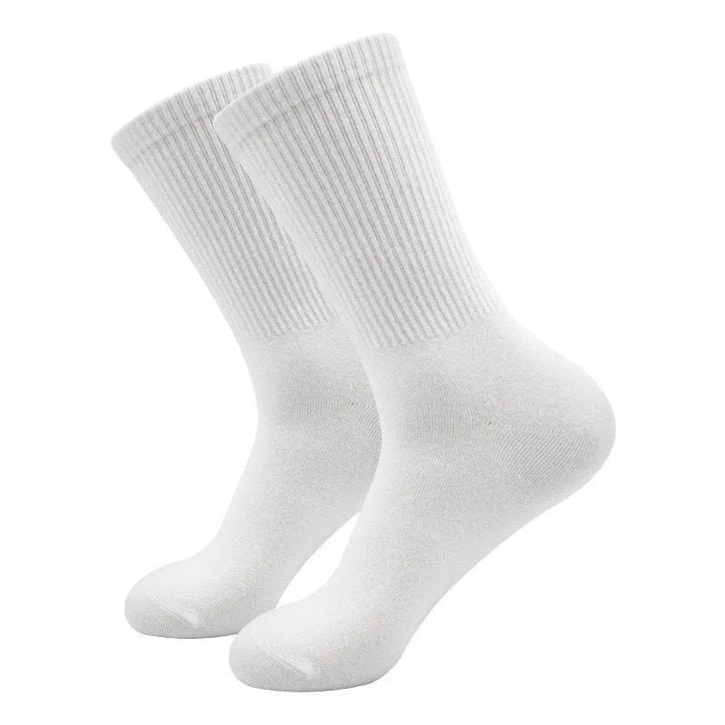 A pair of black mid-calf sports socks made from polyester cotton fabric.