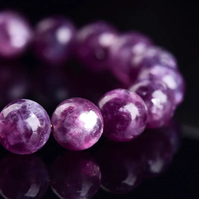 Purple Grandmother Crystal geometric bracelet with polished beads.