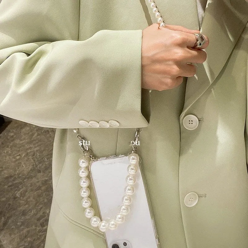 Soft iPhone case with large white pearl decoration and silver chain in Japanese Korean style.