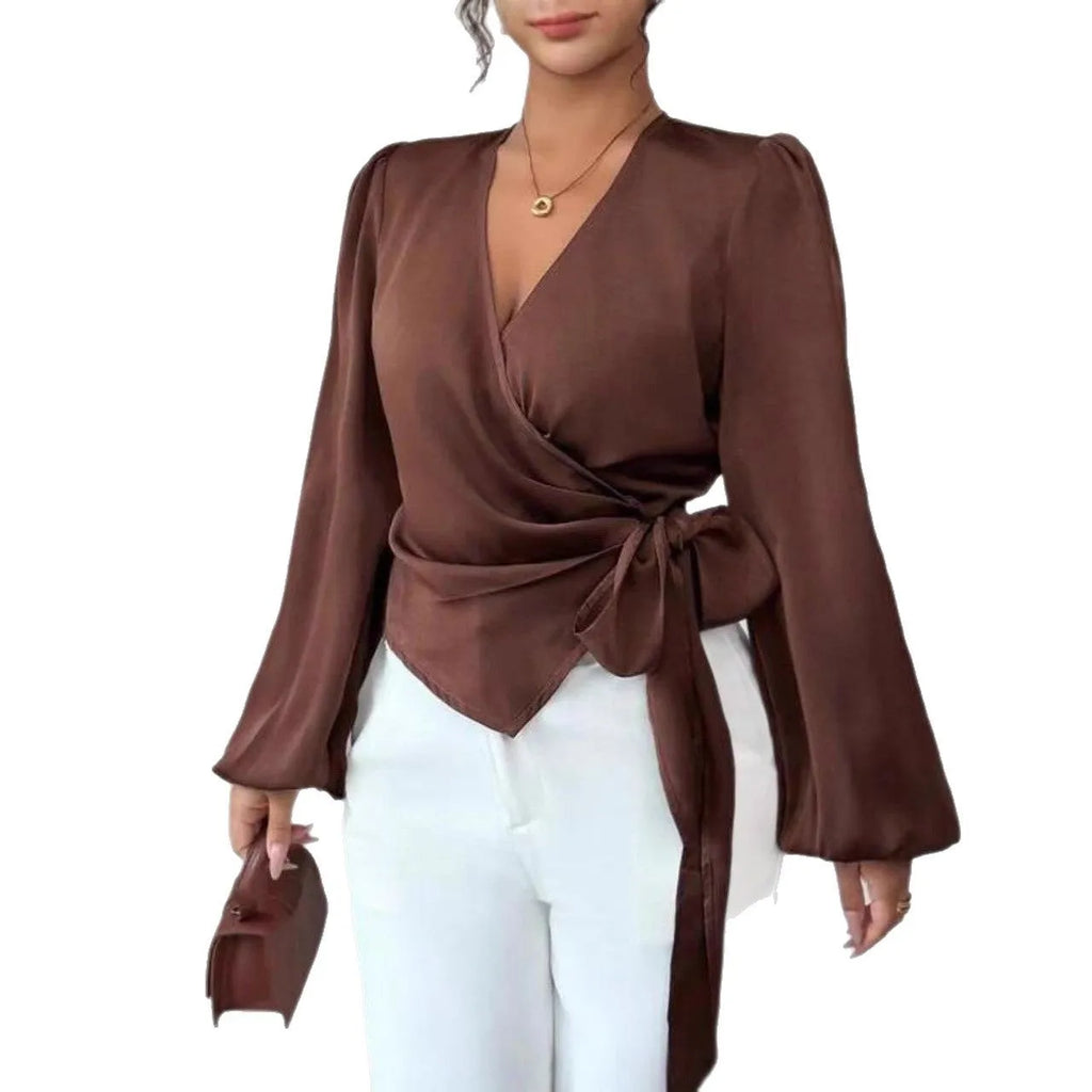 Brown long-sleeved waist-cinching shirt with ribbon detail on a female model