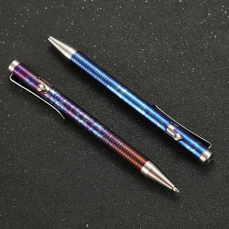 Titanium alloy bolt action ballpoint pen with magic colour phantom finish showing gun bolt handle detail.
