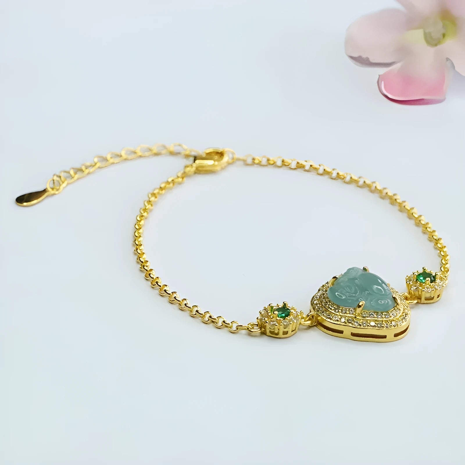 Jade bracelet with inlaid Maitreya Buddha carving in emerald blue water colour