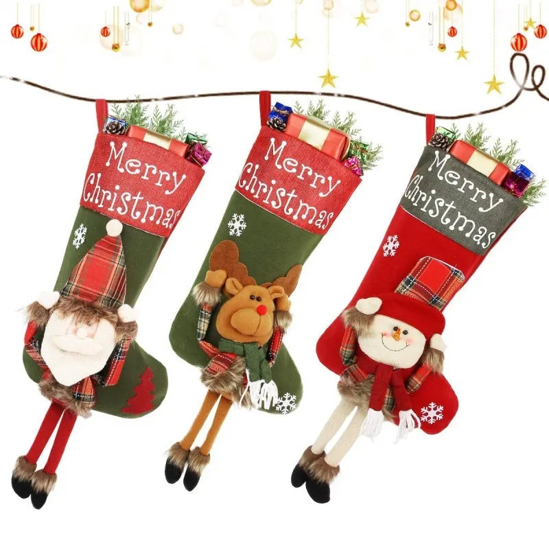 Three large Christmas stockings with Santa, Snowman and Reindeer designs hanging from a mantelpiece