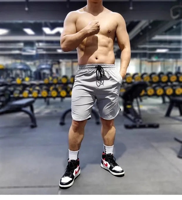 Men's thin quick-drying running shorts in black, blue, or grey, made from nylon and spandex.