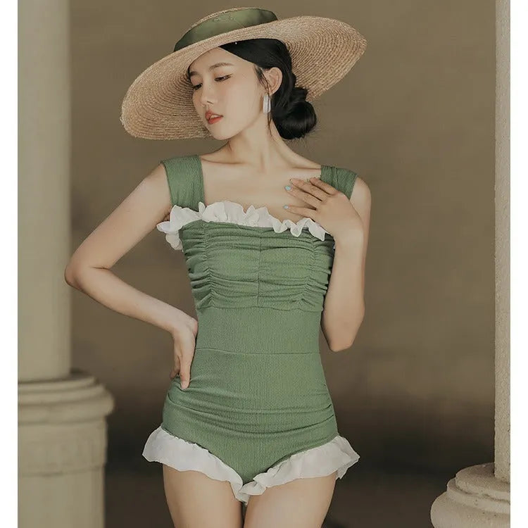 Korean style triangle top one-piece swimsuit for women with high waist in black colour.