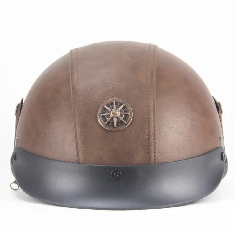 Black retro handmade leather half helmet for motorcycles on a plain background.