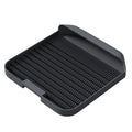 Large black cat litter pedal with slanted mouth design and textured surface for litter containment