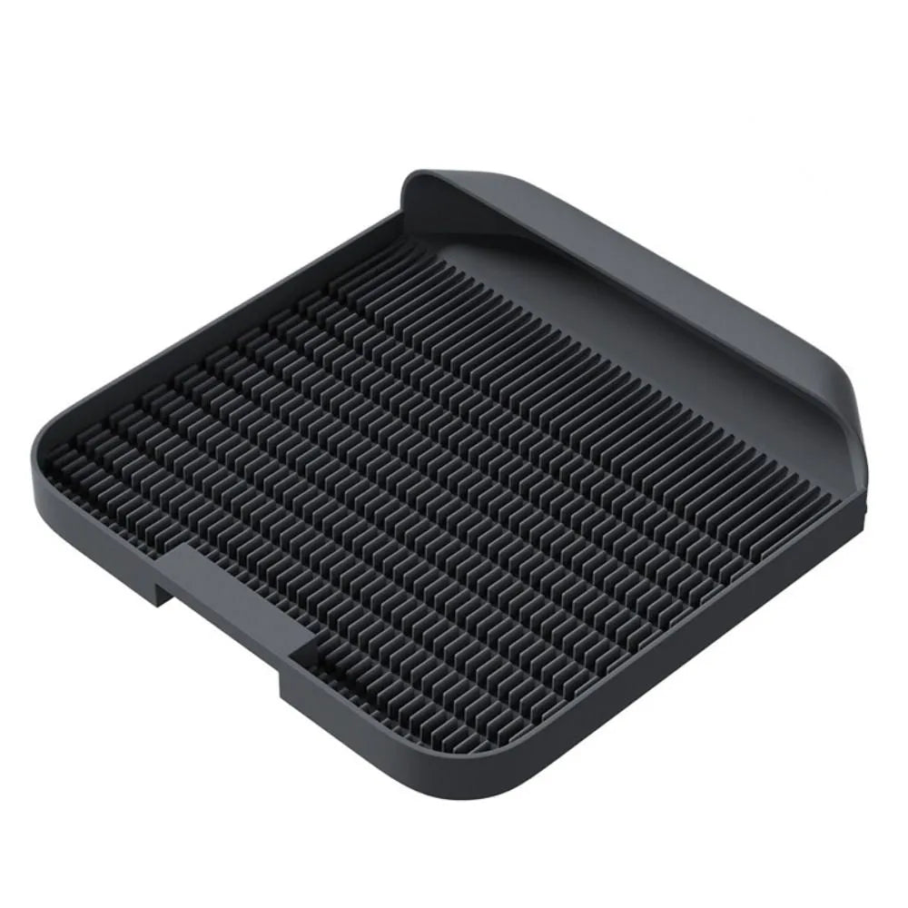 Large black cat litter pedal with slanted mouth design and textured surface for litter containment