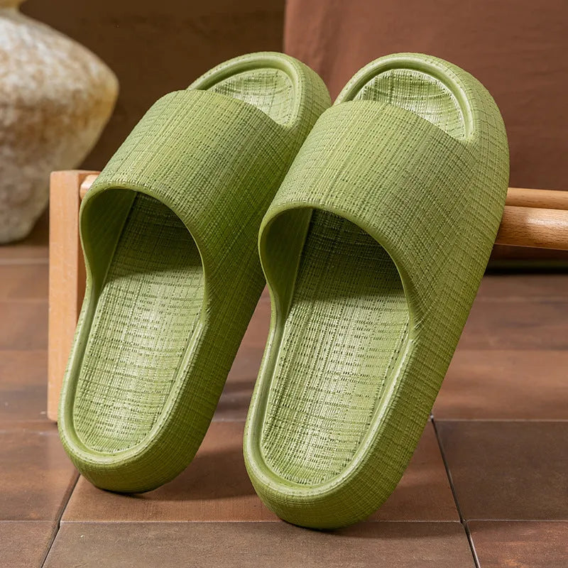 A pair of khaki coloured EVA toe ring slippers with a soft non-slip sole, shown on a white background.