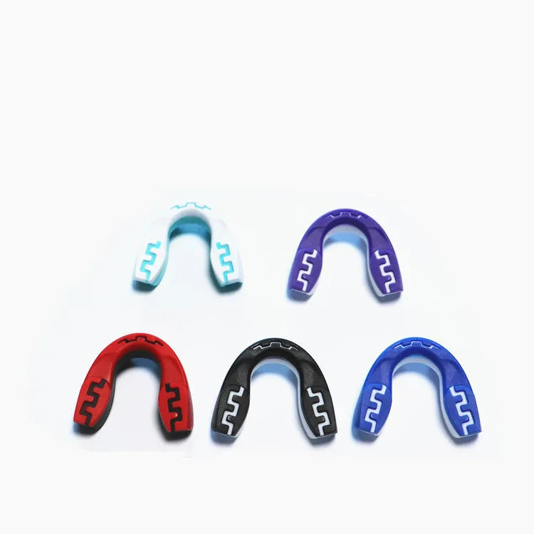 Adult boxing mouthguard with tooth socket design in three colour variations