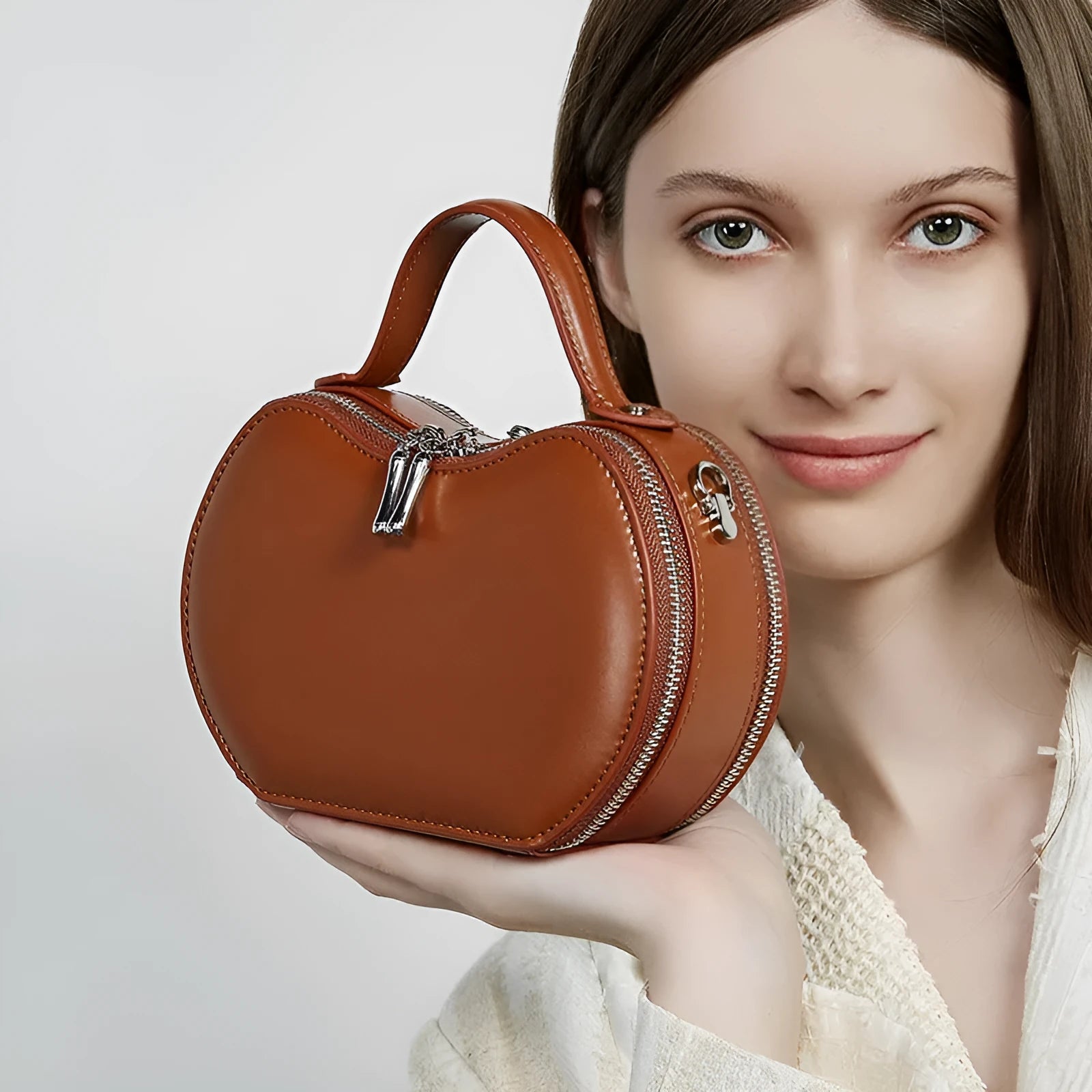 Creative fruit leather heart shape cowhide messenger bag in light brown with single shoulder strap