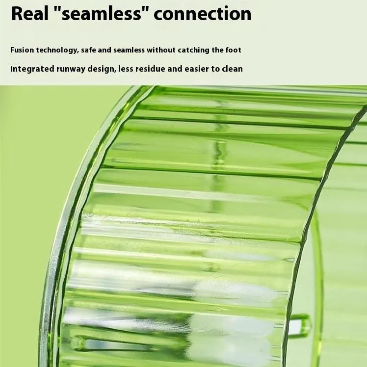 A transparent plastic bird running wheel toy mounted on green cage bars.