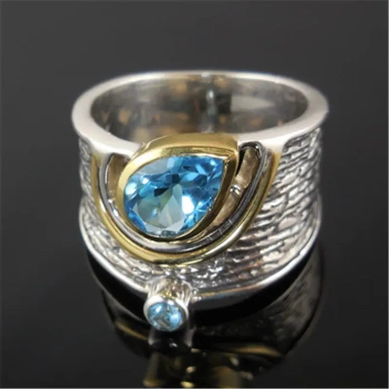 Blue rhinestone zircon ring with a Chinese style drop shape on an alloy band.