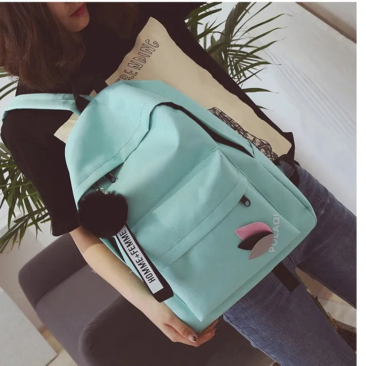 Canvas college style schoolbag in green colour showing front view with dimensions 40x28x13cm