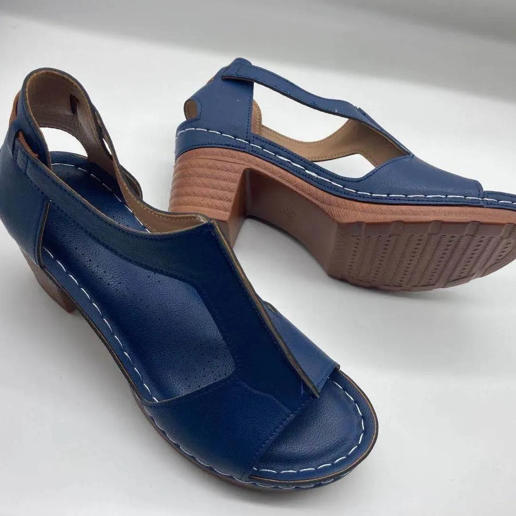 Women's beige peep toe wedge sandals with a buckle strap and low heel