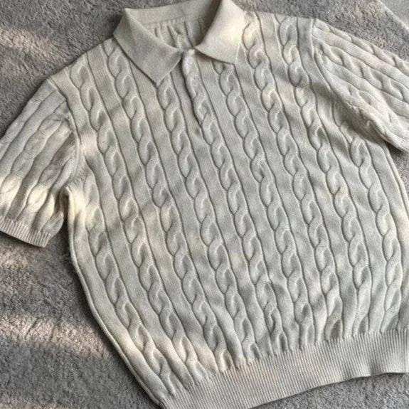 Man wearing a gray knitted short sleeve crew neck t-shirt, casual summer outfit.