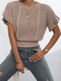 White knitted pullover sweater with twisted string ruffled short sleeves creating 3D pattern effect