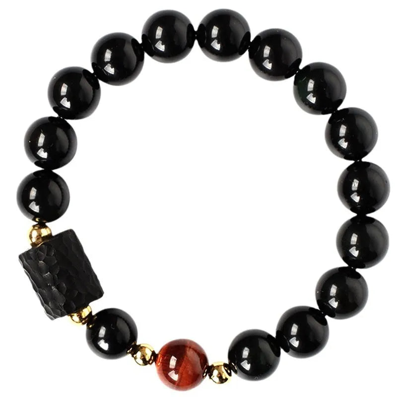 Obsidian bracelet with tiger eye beads in 10mm size showing manual craftsmanship and unisex design