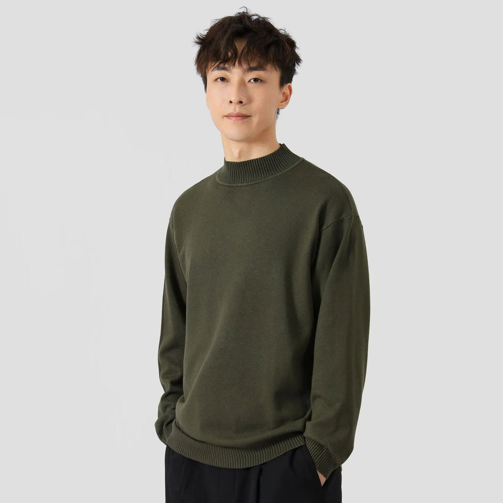 A man's loose-fitting solid colour long sleeve sweater in a chemical fibre viscose blend.