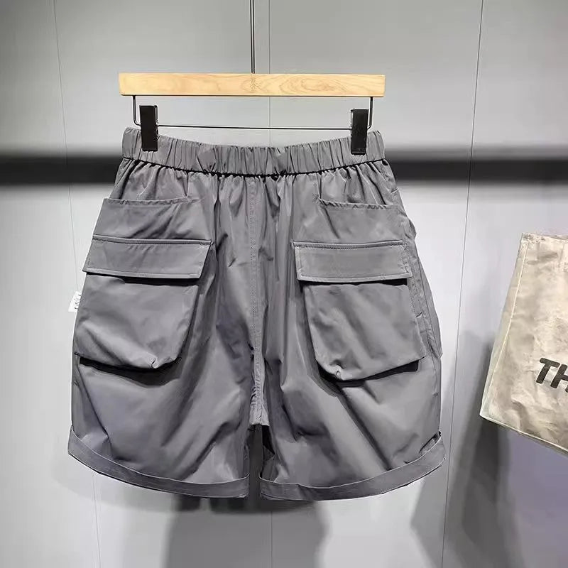 Men's black workwear shorts with multiple pockets and loose fitting design