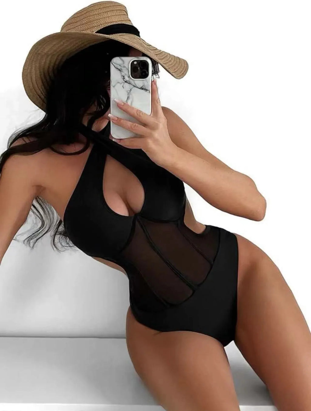 Ladies black one-piece bikini swimsuit made from nylon and spandex fabric on a mannequin.