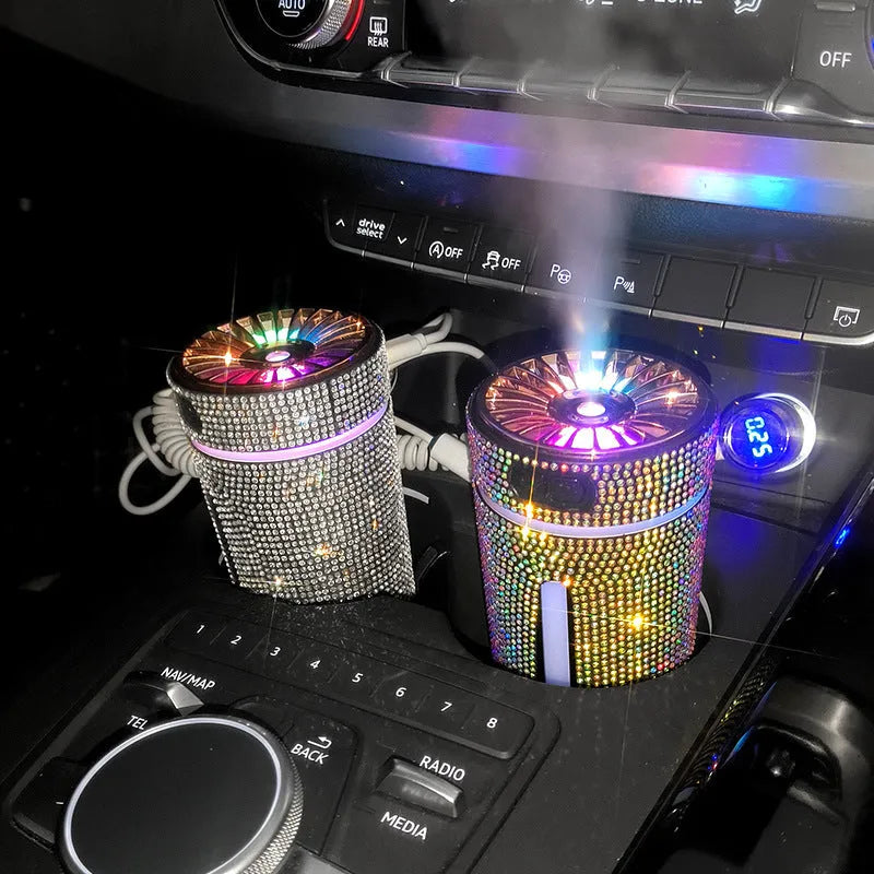 Rhinestone-decorated USB car humidifier with LED lights on a dark background.