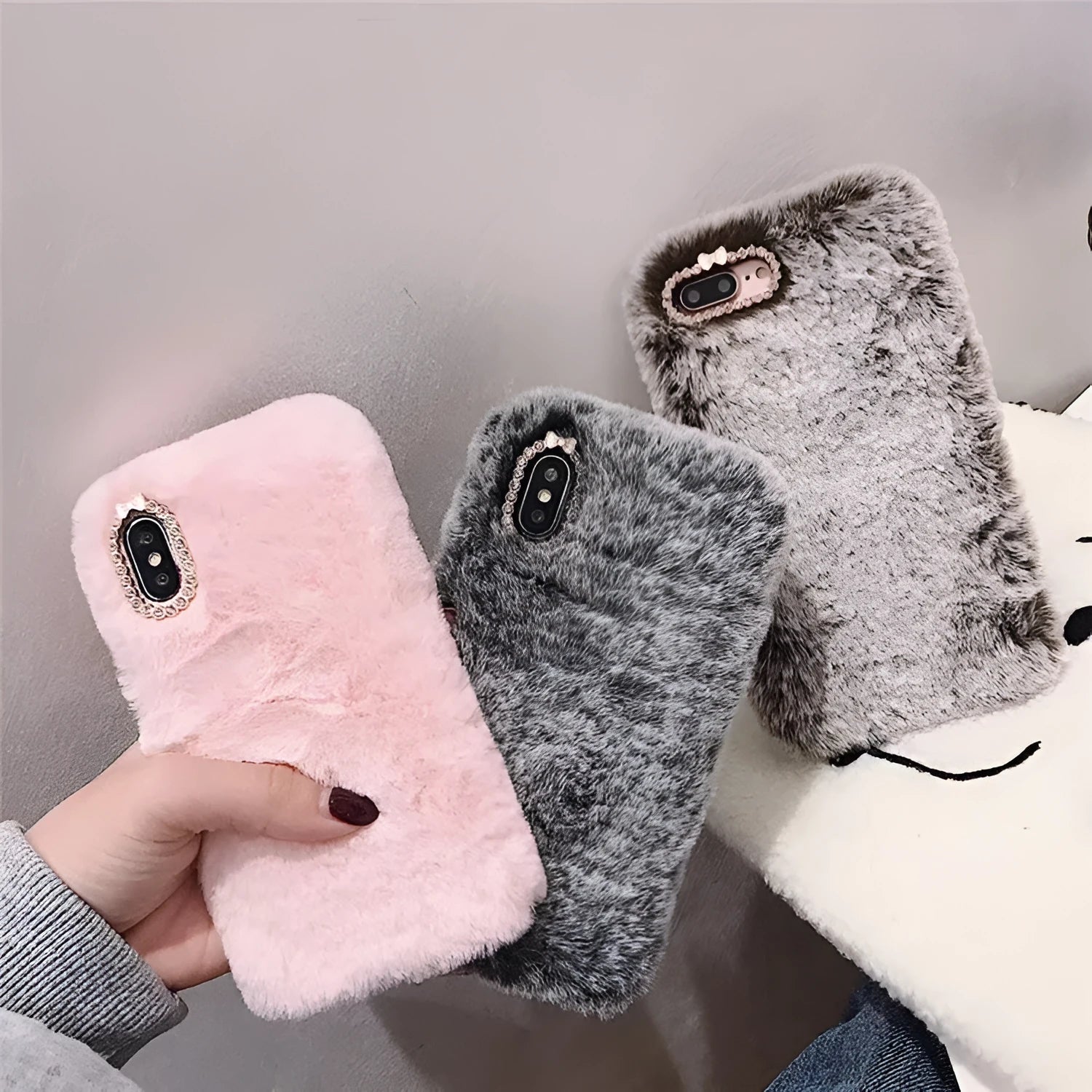Rabbit hair silicone iPhone case with rhinestone detail and soft plush bottom shell in grey, brown, or pink colour