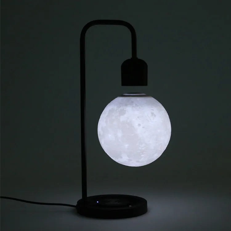 Magnetic levitation table lamp with wooden base, floating light, and optional wireless charger in colour A