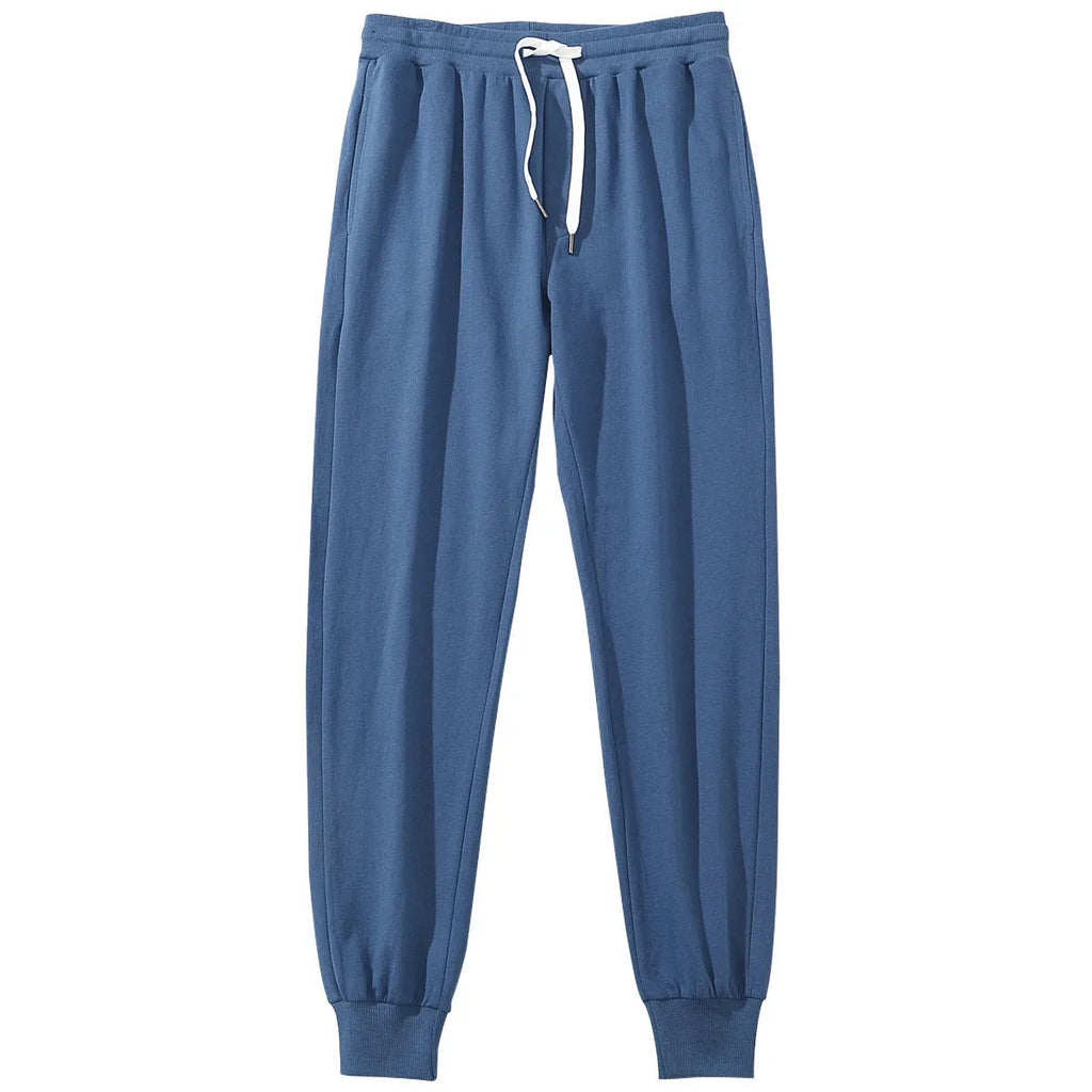 Men's cotton sports casual trousers, loose pencil cut with drawstring mid waist, shown in a solid colour option