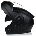 Matte black full face motorcycle helmet with integrated battery visor on a stand