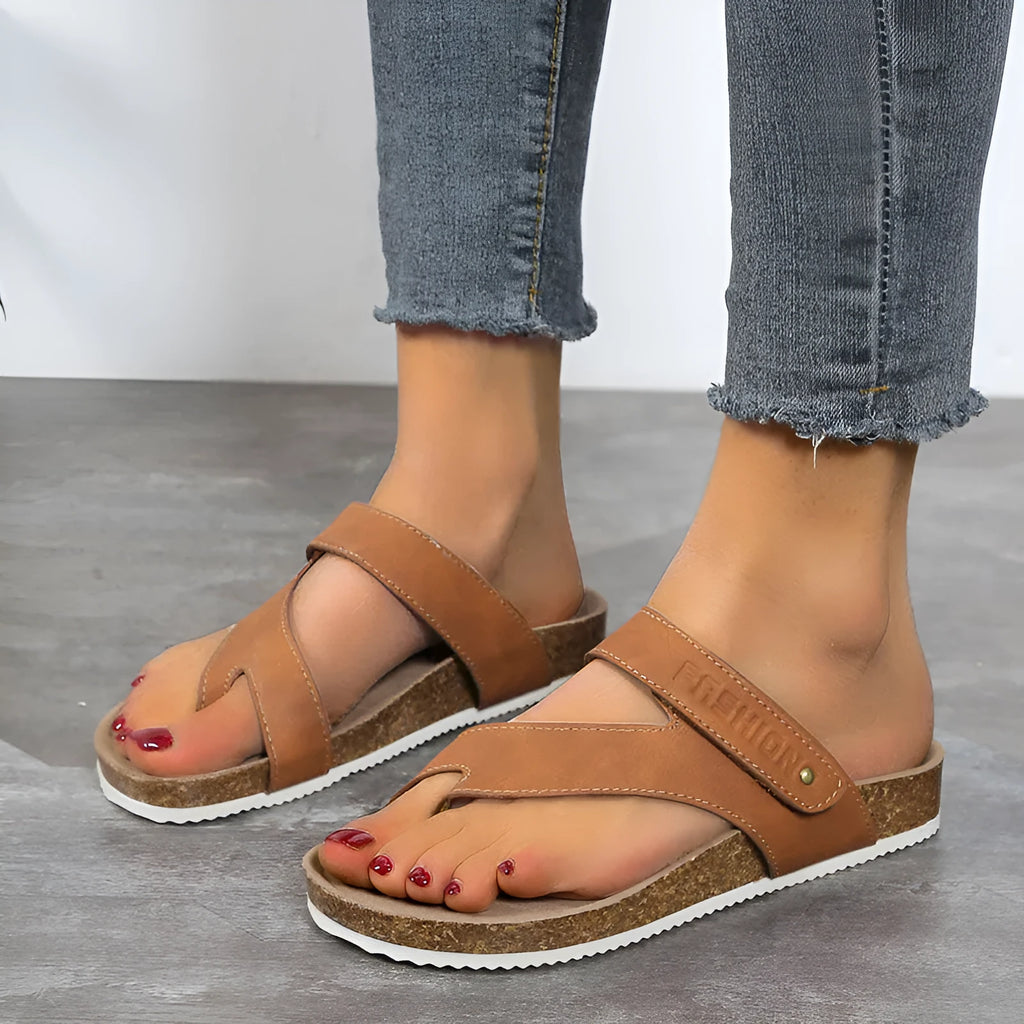 A pair of solid-colour flat toe ring flip-flops with a thick foam sole, shown in blue.