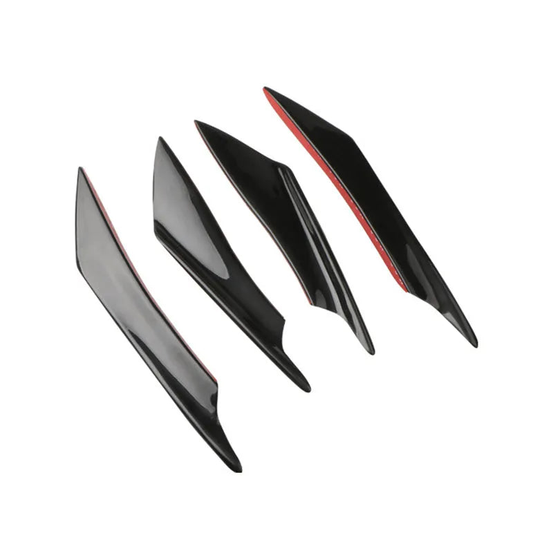Set of four ABS plastic bumper air knife spoilers in a carbon fibre finish for car modification.