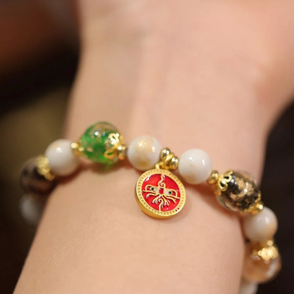 Handmade coloured glaze glass bracelet with Five Gods of Wealth geometric design in blue, green, red, white, or yellow.