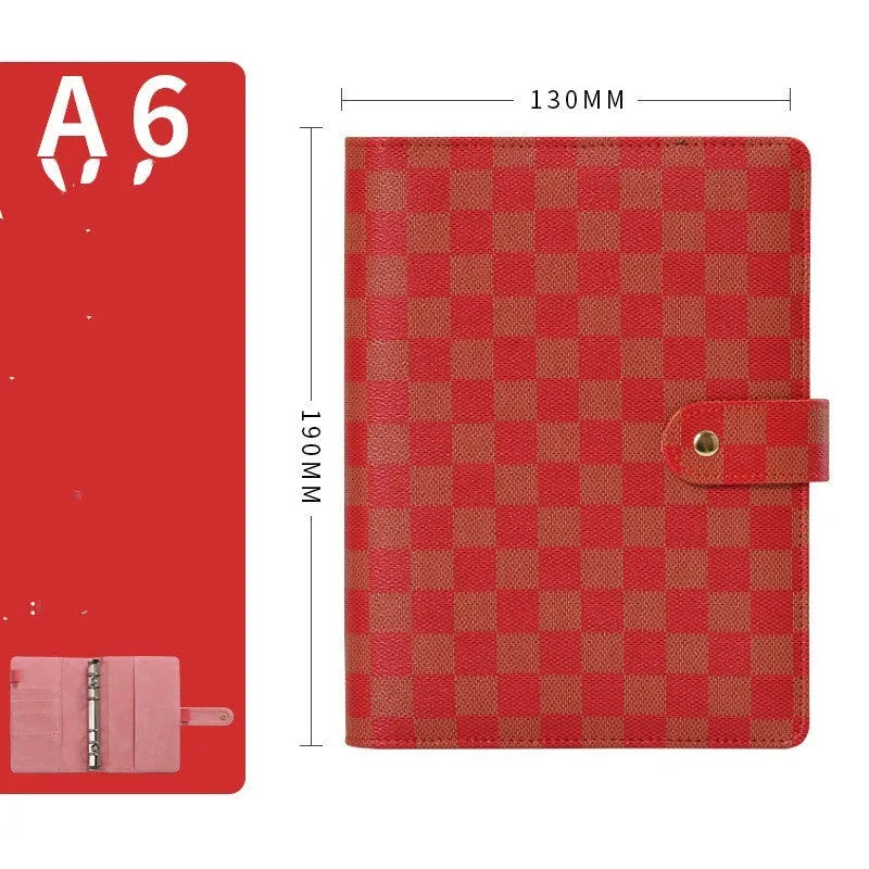 Red checkered imitation leather loose-leaf notebook in A5 size, showing the binding mechanism.