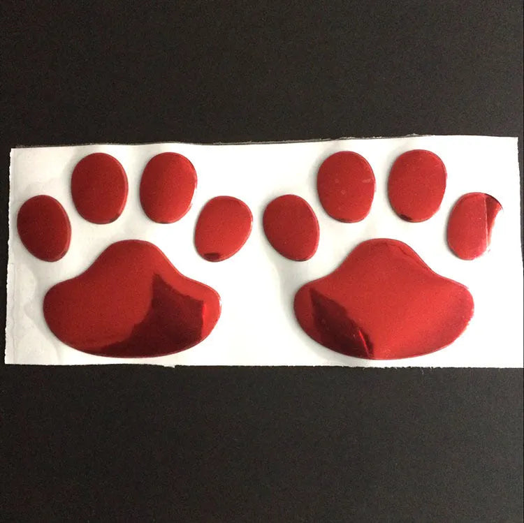 Hand-shaped brush car sticker with dog footprints design in red, silver, gold or black colour, 7 cm long.