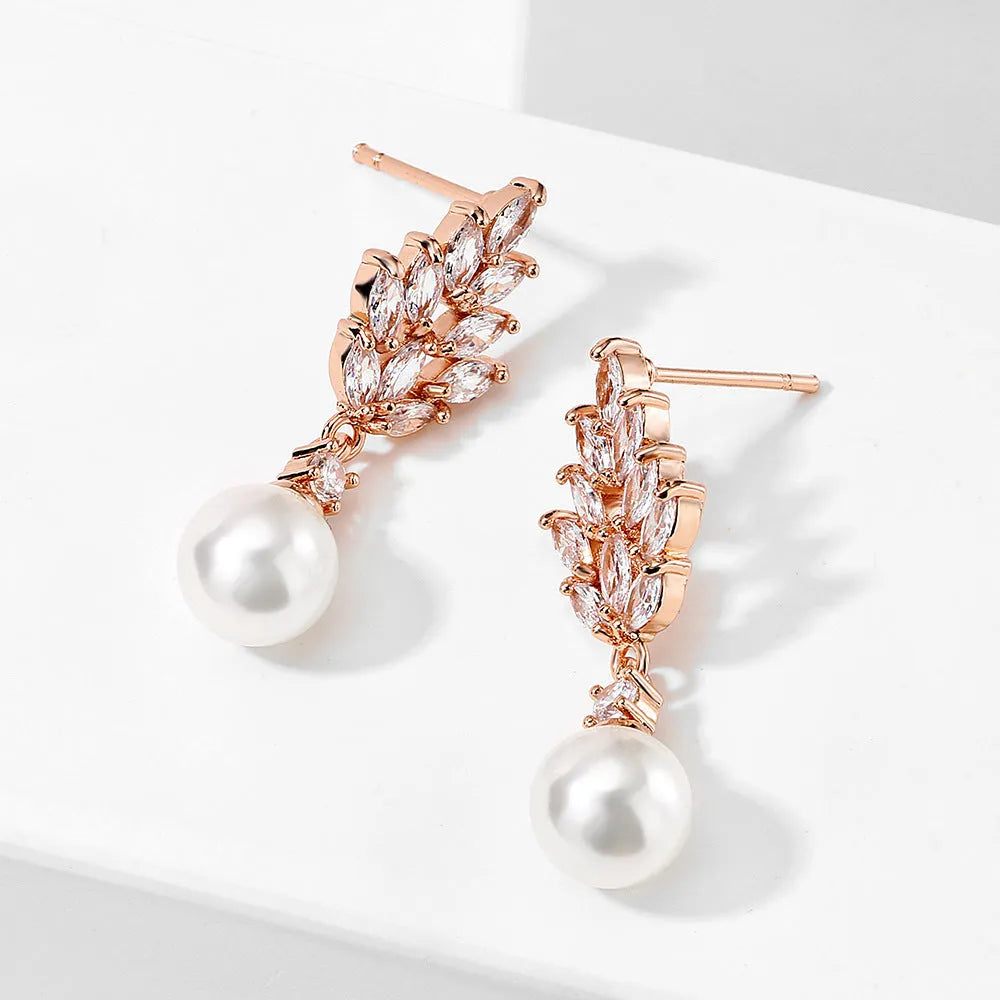 Geometric flower earrings with micro inlaid zircon and pearl details in gold, platinum, or rose gold finishes