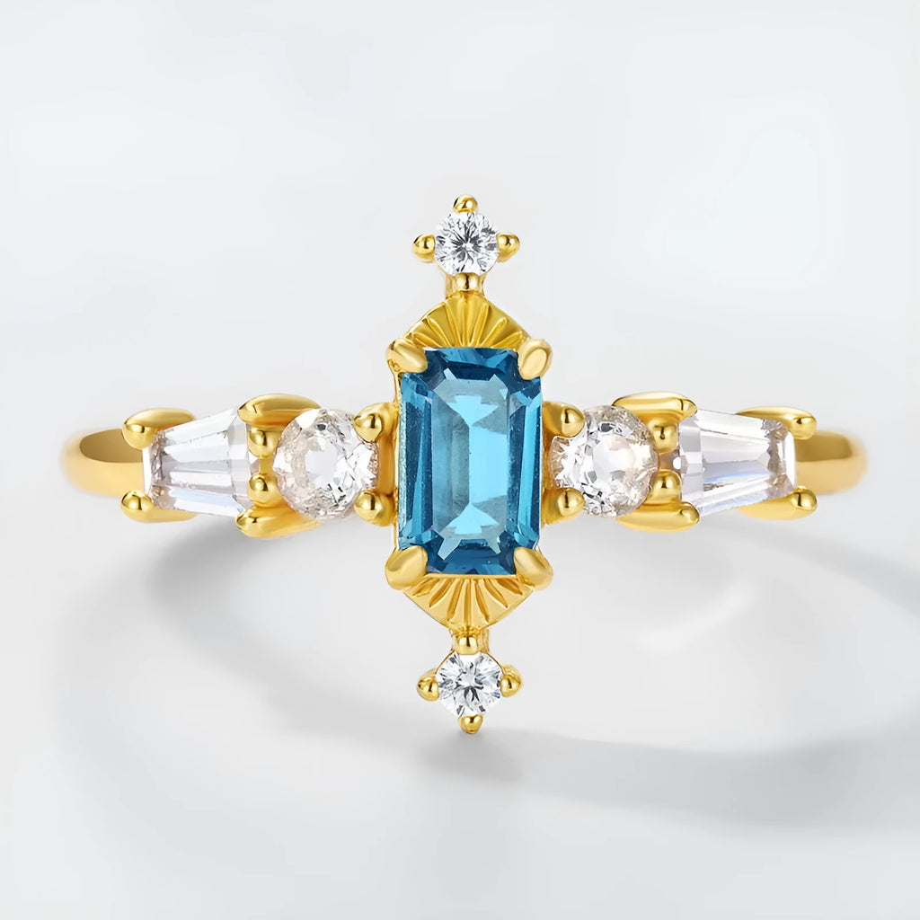 S925 sterling silver adjustable ring with London blue topaz colour, 10K gold electroplated finish, and geometric quadrilateral shape