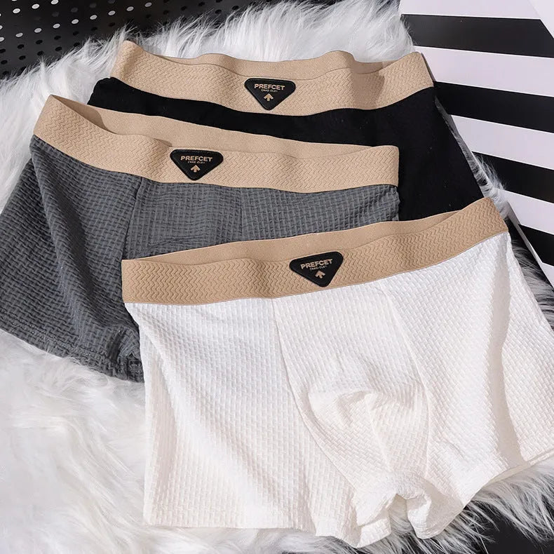 Men's ice silk nylon mid-waist boxer shorts in breathable sport style, available in multiple colours
