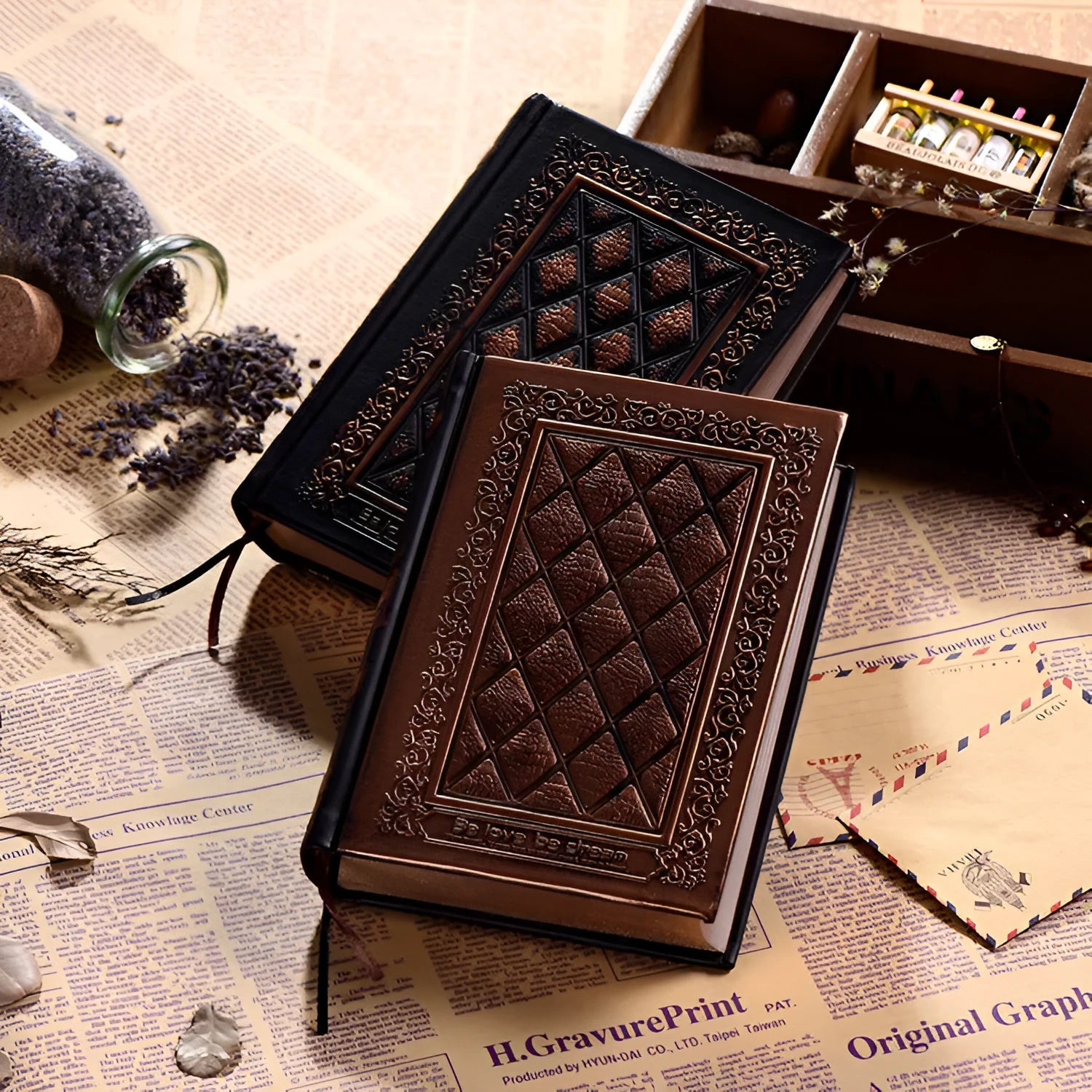 Embossed faux leather notebook with textured cover in bronze or black gold colour with thick writing pad