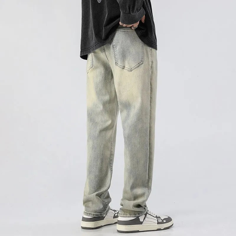 Men's washed distressed slim straight cotton tapered pants in Cement Yellow